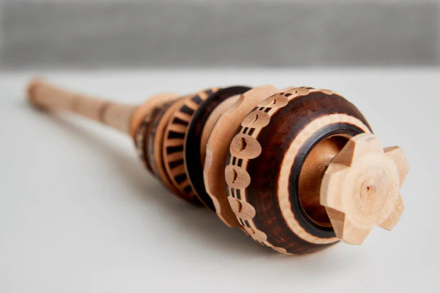 Closeup of a traditional molinillo next to the Velvetiser Whisk - the two are clearly related.