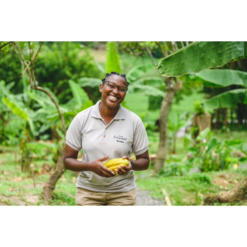 Cacao farmer holding a cacao pod