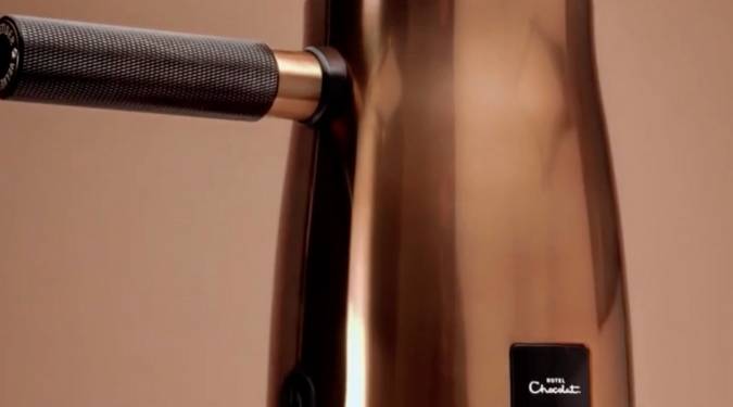 Luscious drinking chocolate pours from Hotel Chocolat Velvetiser. Real chocolate flakes are added to the copper hot chocolate maker, and perfect hot cocoa is 